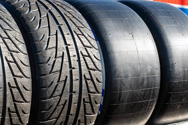 Racing and street tires side by side showing rubber and tread for high performance vehicles