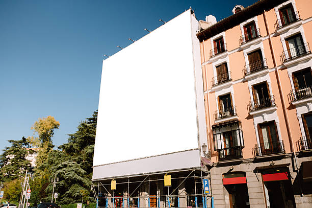 istock Blank billboard covering a building facade 2245969535