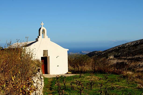 istock ​Cycladic White Church Overlooking Dry Vineyard 2245972907