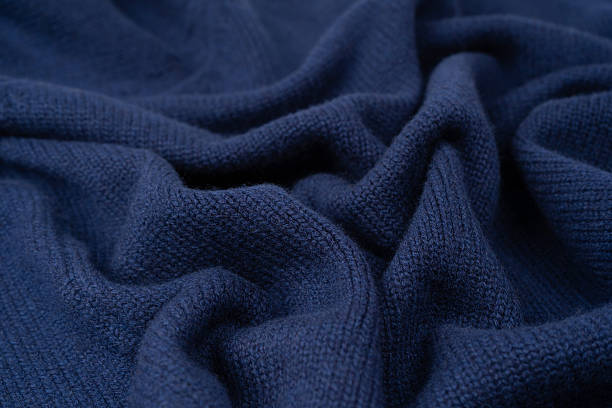 istock Navy blue merino wool sweater texture as background. Top view. 2245974612