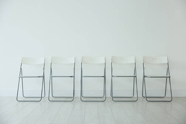 Chairs Stack On Red - White Background - 3D Rendering