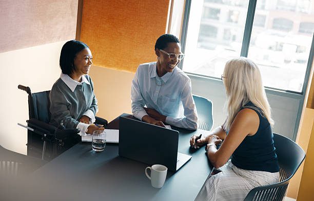 istock Diverse group of professionals collaborating in a modern workplace setting 2245976512
