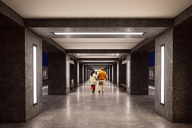 istock Young Mixed-Race Couple Walking in Berlin Metro Station While Holding Hands, Captured From Behind 2245976805