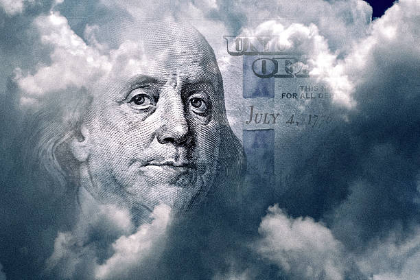 istock American One Hundred dollar in storm clouds, Making money concept 2245978007