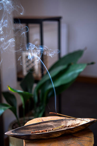 istock Close-up of incense burning inside the house. 2245979482