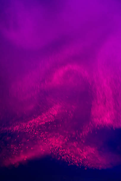 A rich, purple-hued abstract scene with swirling fog and speckled light; perfect for dramatic backdrops, digital art, and moody design projects conveying mystery, nightlife, or dreamlike atmosphere.
