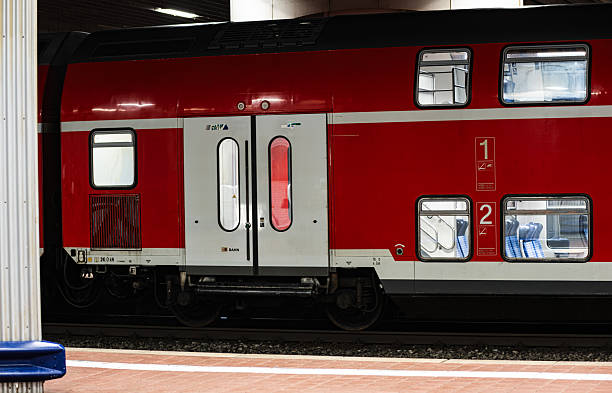 Stettbach / Railway Station. The image shows an arriving S-Bahn train at the station, with few people waiting at the platform.