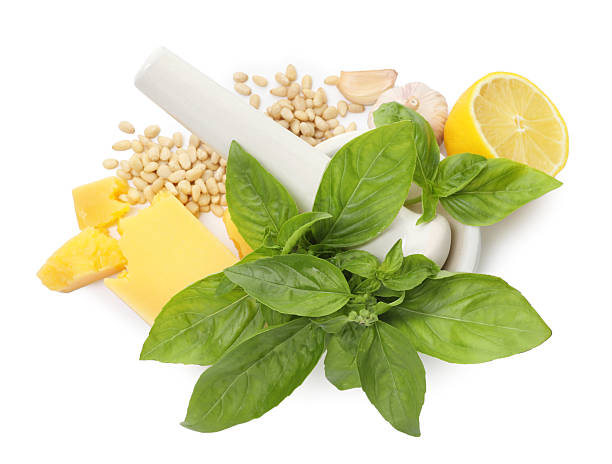 Fresh ingredients for pesto sauce isolated on white, top view