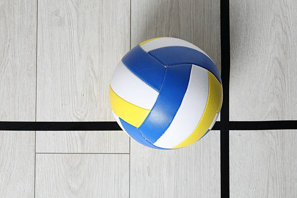 istock One volleyball ball on floor, top view. Space for text 2245985216
