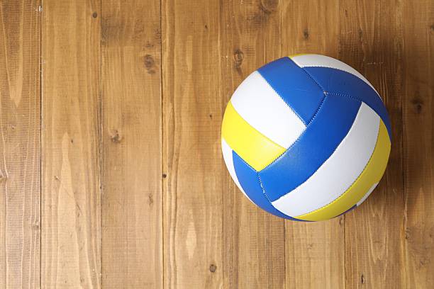 istock One volleyball ball on wooden surface, top view. Space for text 2245985295