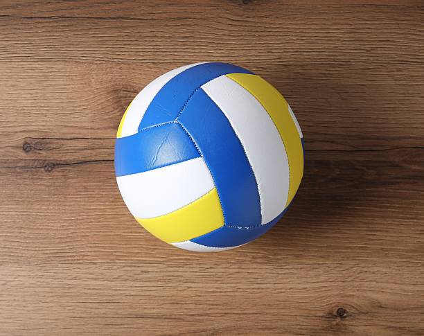istock One volleyball ball on wooden surface, top view 2245985342