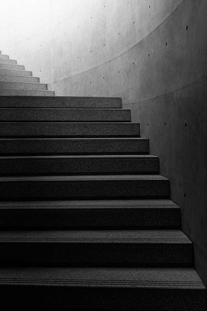 istock Empty stone stairway near concrete wall 2245990305