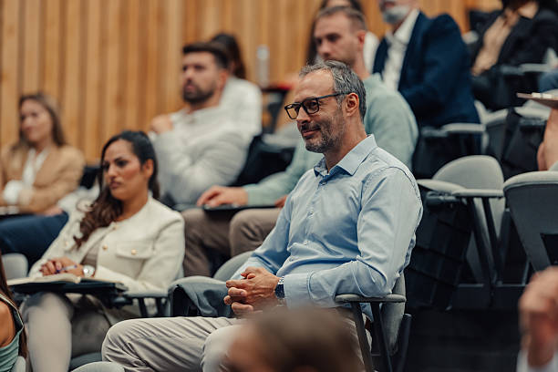 istock Professional audience listening during business conference presentation 2245990585