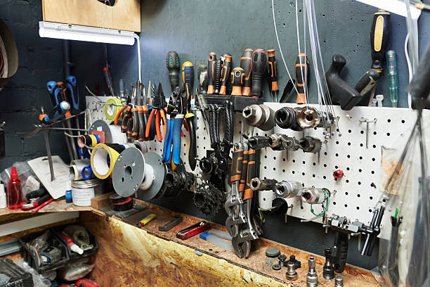 istock Assorted Bicycle Repair Tools and Parts Hanging on Workshop Wall Pegboard 2245991350