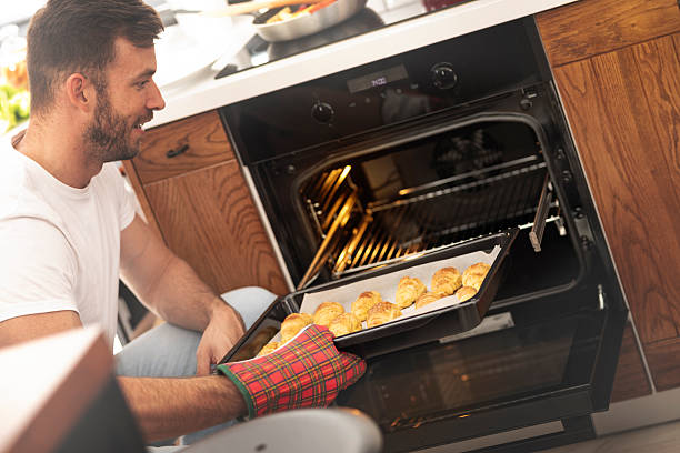 istock Satisfied young handsome chef proud of his masterpiece. 2245991867