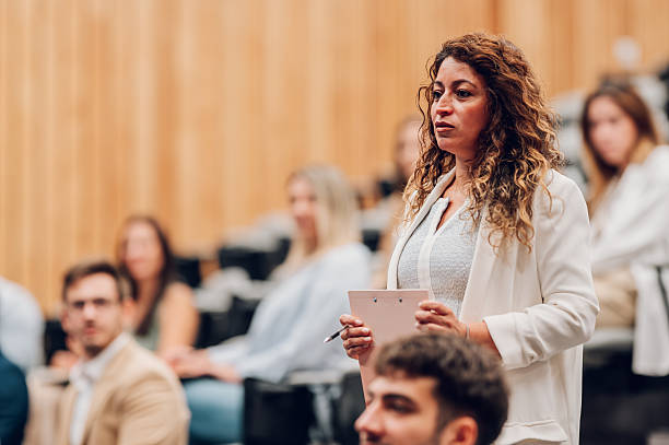 istock Woman asking question during business conference seminar 2245992213