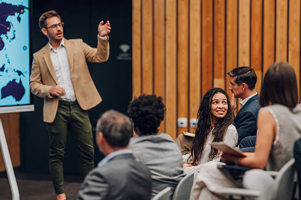istock Speaker talking during business conference with audience listening 2245992380