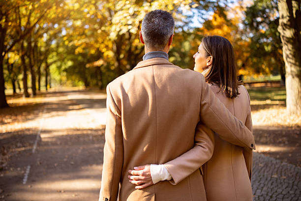 istock Couple Embracing in Autumn Park in Berlin 2245993348