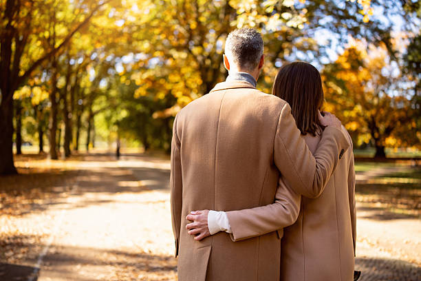 istock Couple Embracing in Autumn Park in Berlin 2245993380