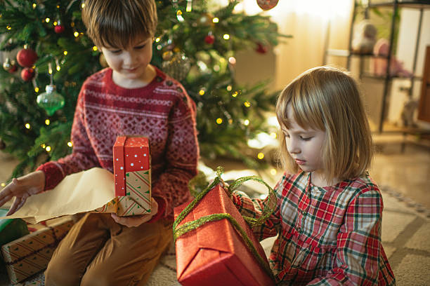 istock Children with Christmas presents 2245993915