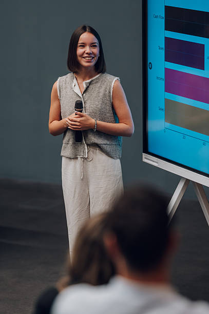 istock Woman presenting business data at a conference 2245993952