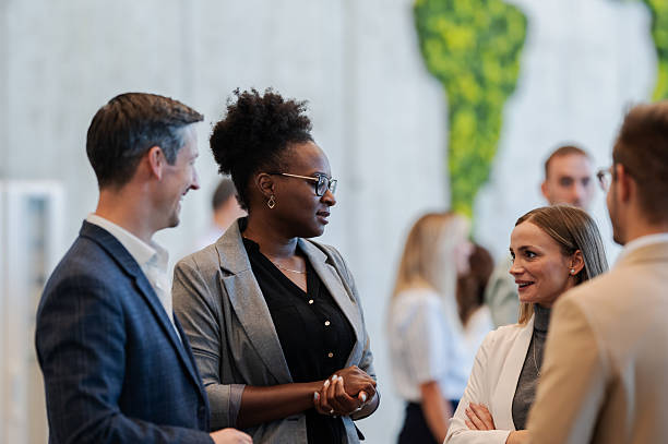 istock Diverse business professionals networking at a conference 2245994290