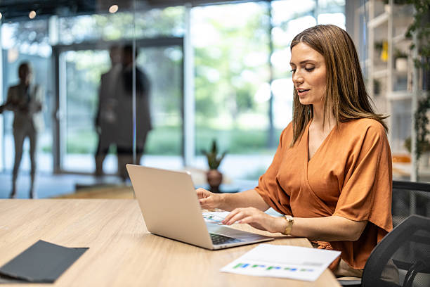 istock Woman engaged in productive work at a serene office 2245996447