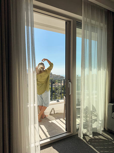 istock A woman  on the balcony 2245997338