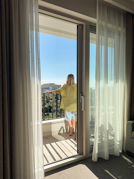 istock A woman  on the balcony 2245997345