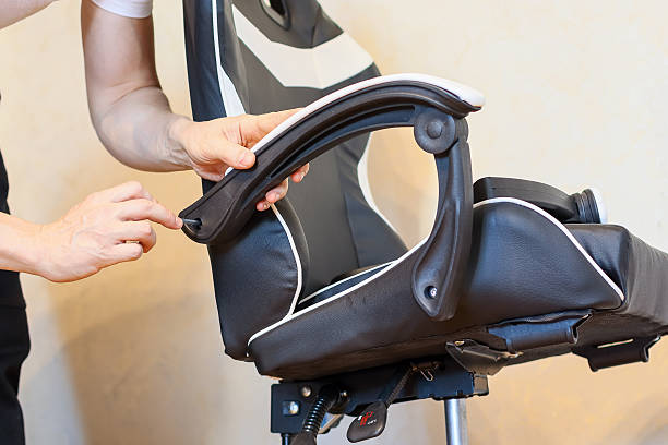 istock Woman adjusting armrest attachment on gaming chair 2245997425