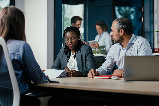 istock Diverse Business Team Meeting in Modern Glass Office 2245998051