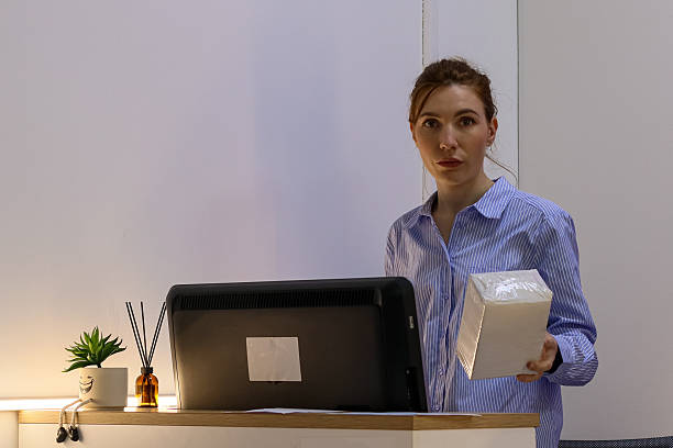 istock Woman carrying wrapped package at pickup station 2245998295