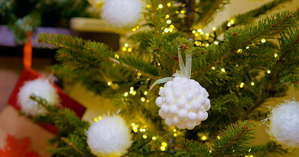 Enjoy the festive ambiance as decorations adorn a Christmas tree
