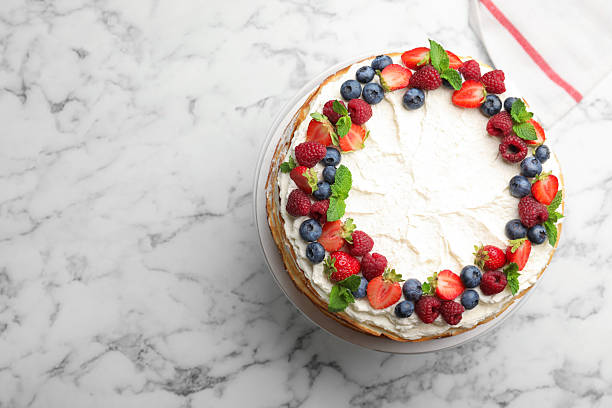 istock Delicious crepe cake with fresh berries on white marble table, top view. Space for text 2246001877