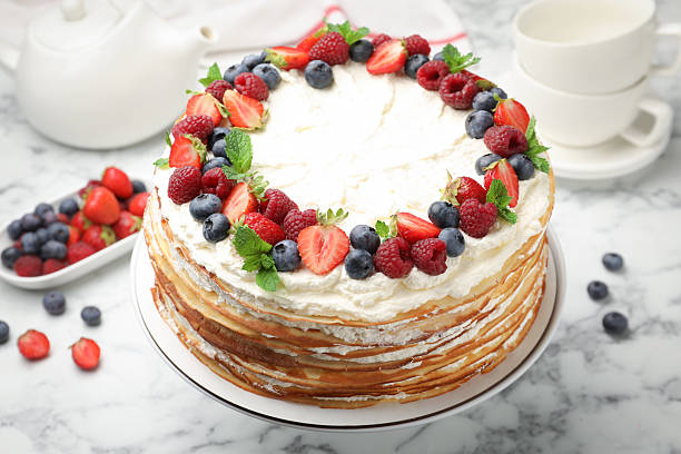 istock Delicious crepe cake with fresh berries on white marble table, closeup 2246002019