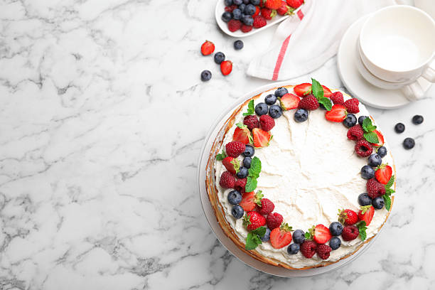 istock Delicious crepe cake with fresh berries on white marble table, flat lay. Space for text 2246002980
