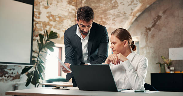 istock Document, team and business people planning in office, insurance development or policy idea. Paperwork, laptop and talk with advisor in meeting, coverage discussion and advice for claims report 2246004528
