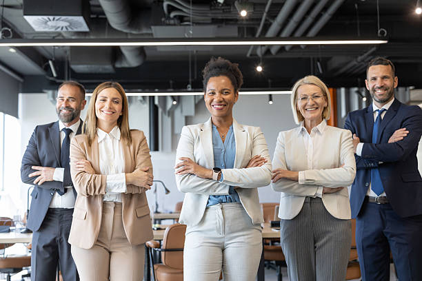 istock Confident Team of Professionals Posing in Office Space 2246004586