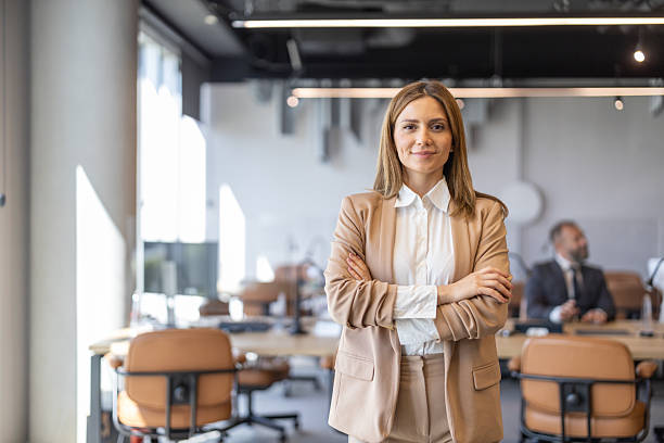 istock Confident Woman Posing with Crossed Arms in Office 2246004588