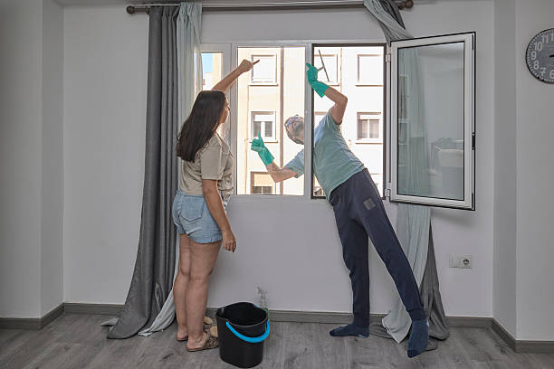 istock Man cleaning windows at home 2246007681