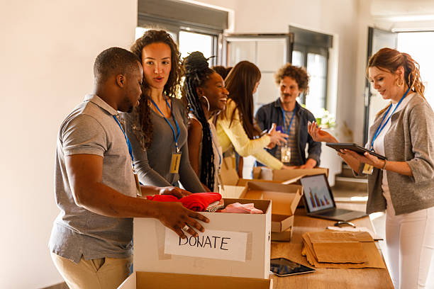 istock Volunteers working together to organize boxes with donations 2246008719