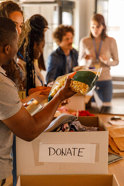 istock Volunteers working together to organize boxes with donations 2246008732