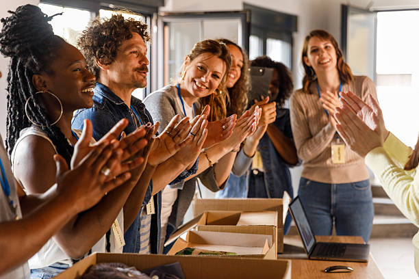 istock Group of volunteers applauding after successfully preparing donations 2246008743