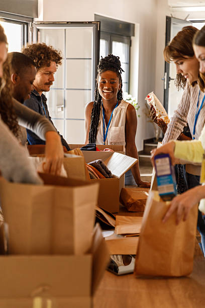 istock Volunteers creating care packages during a food drive 2246008756