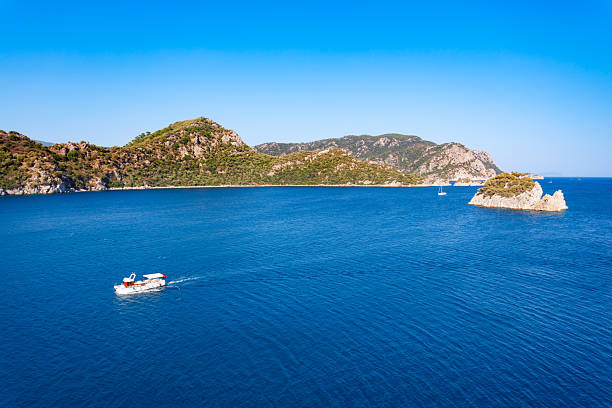 Boat near the Icmeler beach aerial panoramic view. Icmeler is a town near Marmaris city in Mugla Province, Turkey.