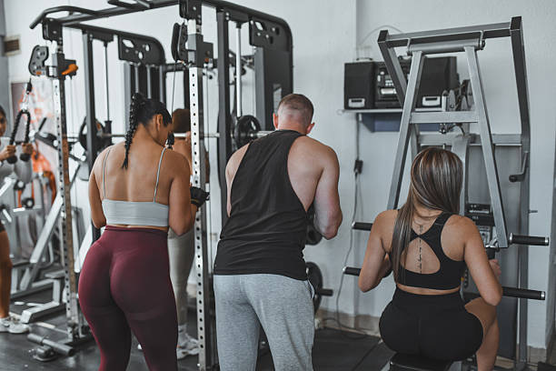 istock Group Fitness Training Session With Strong Instructors In A Modern Gym Setting 2246010696