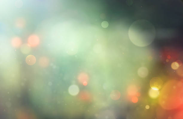 istock Abstract green background with scattered gold and red bokeh. festive background 2246012489