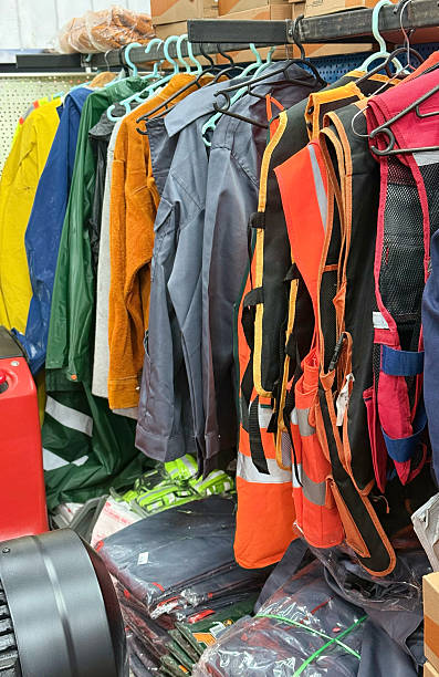 istock Assorted Workwear and Safety Vests Displayed on Store Rack 2246013892