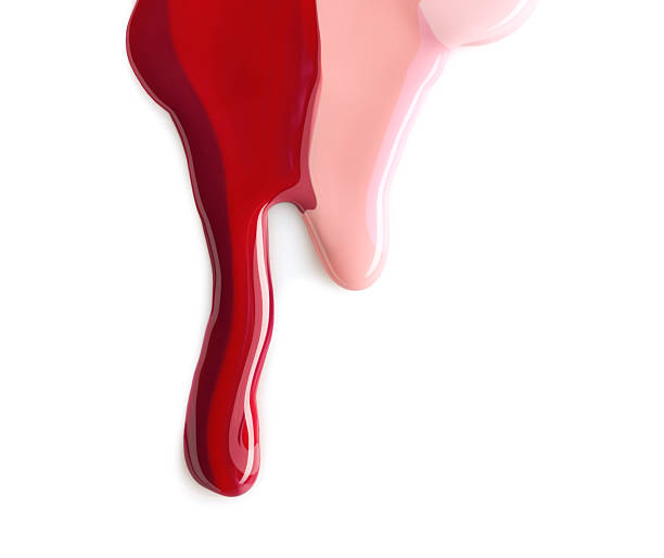 istock Spilled different nail polishes on white background, top view 2246016741