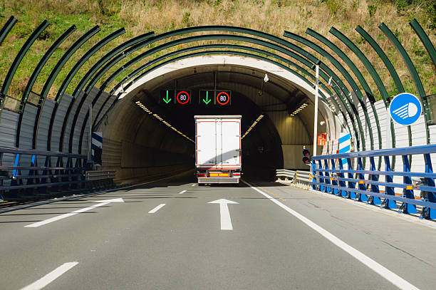 Rear view of a truck entering a highway tunnel